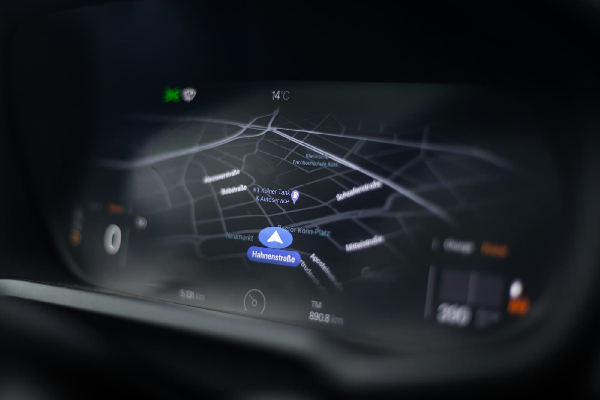 Navigation map glowing on a car's dashboard display at night