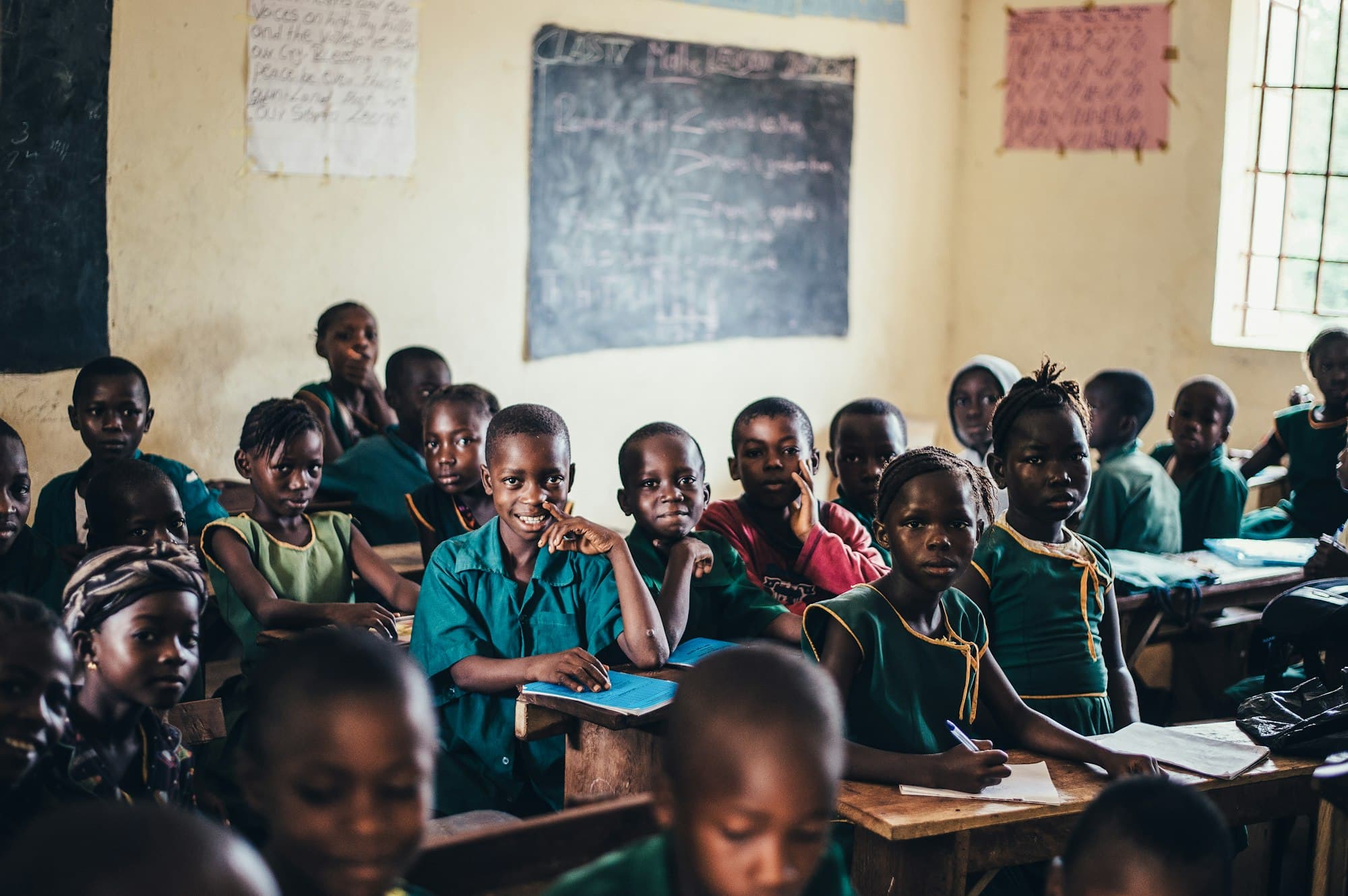 Pupils in school uniform seated in a classroom