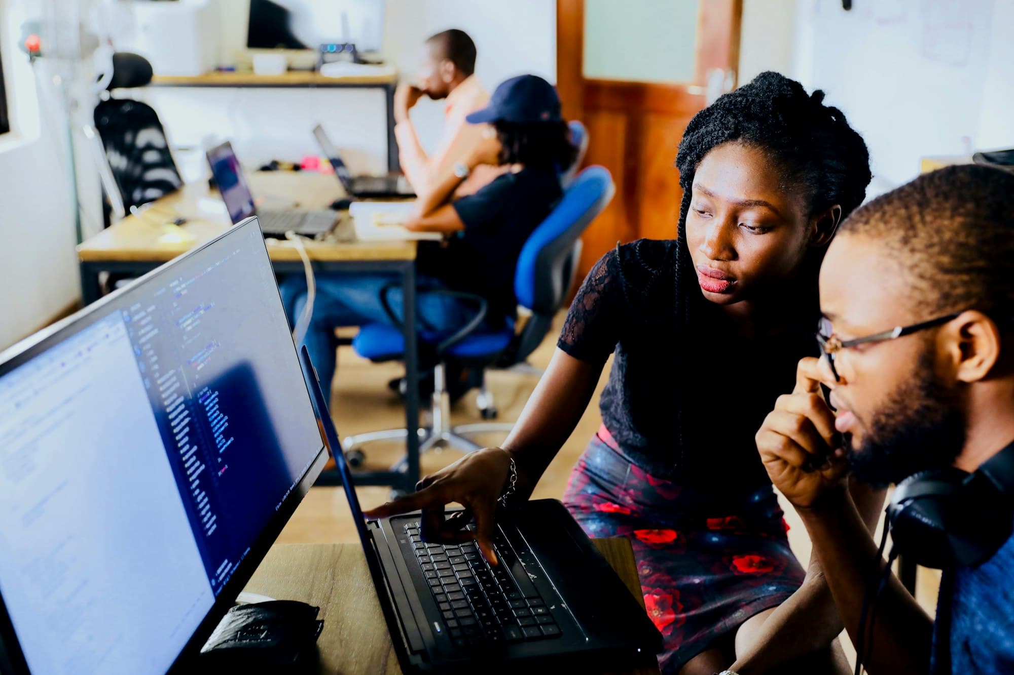 Developers working together in a bright office